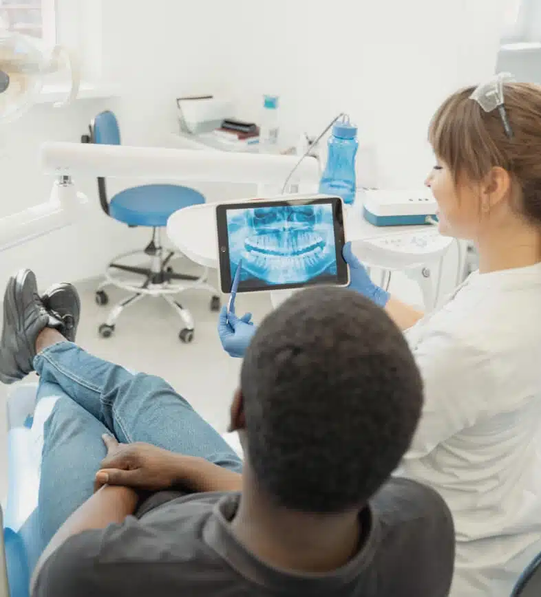 dentist speaking with a patient considering dental implants